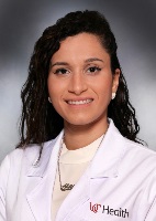 Ousta Alaa with UCH lab coat UC Logo