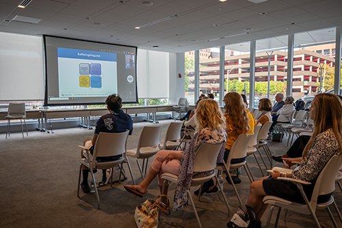 Flourishing-Series-Seminar A group of cancer survivors listen to an educational talk.
