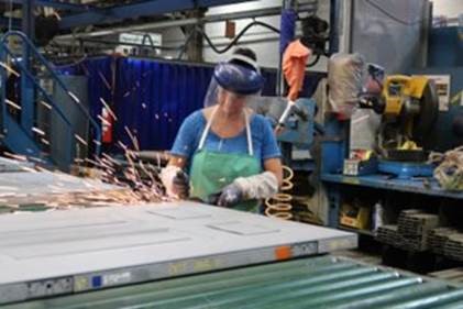 person manufacturing steel in a factory