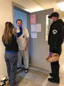 correctional nurse performing a medical test on an inmate