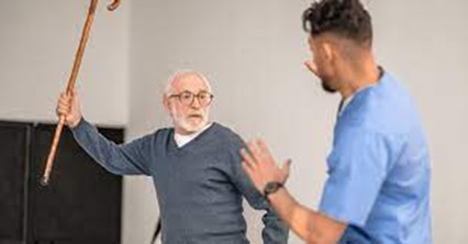 man swinging cane at another man