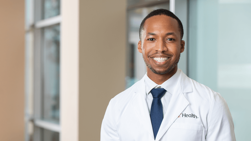 Photo of the program director, Dr. Nate Harris, in his white coat