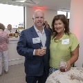 A couple posing with drinks in their hands
