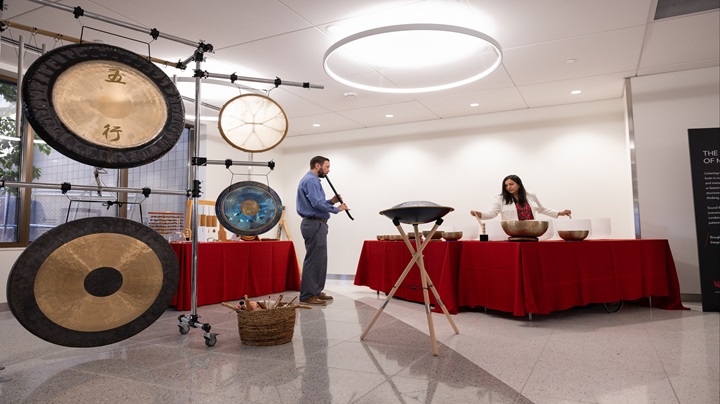 Sound Immersion Blood Cancer Healing Center two people performing sound immersion with gongs, sound bowls, and flutes