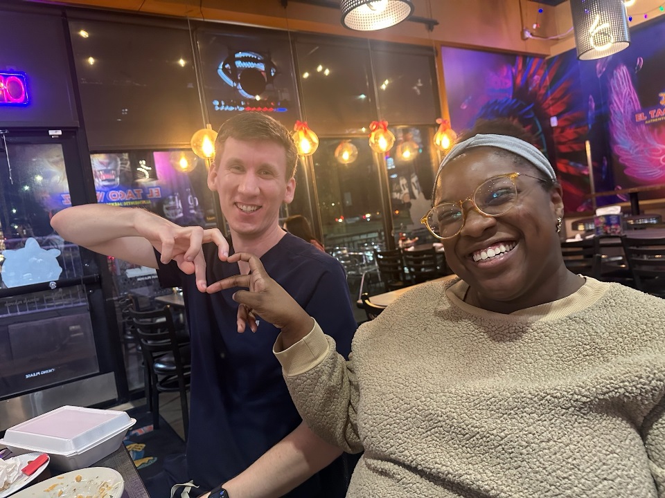 Two residents making a heart