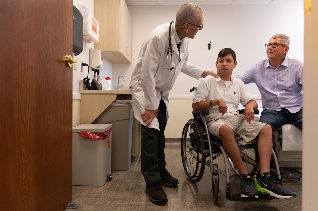 Doctor & Patient Patient in wheelchair seeing doctor