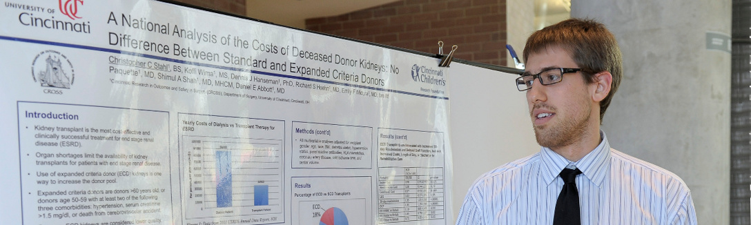 student-in-front-of-research-display student in front of research display
