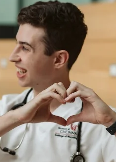 photo of person making  a heart shape with hands